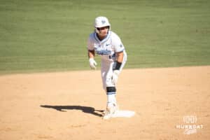 Creighton Bluejays Kenzie Nakasawa looks to steal during a college softball game against UCONN on March 28th, 2025 in Omaha, Nebraska. Photo by Brandon Tiedemann.
