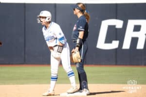 Creighton Bluejays Ashley Smetter cheers after a hit during a college softball game against UCONN on March 28th, 2025 in Omaha, Nebraska. Photo by Brandon Tiedemann.