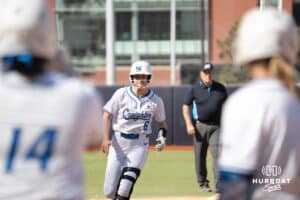 Creighton Bluejays Kaelan Schultz celebrates a home run during a college softball game against UCONN on March 28th, 2025 in Omaha, Nebraska. Photo by Brandon Tiedemann.