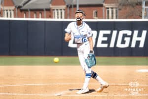 Creighton Bluejays Kenzie Schopfer pitches during a college softball game against UCONN on March 28th, 2025 in Omaha, Nebraska. Photo by Brandon Tiedemann.