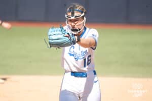Creighton Bluejays Kenzie Schopfer pitches during a college softball game against UCONN on March 28th, 2025 in Omaha, Nebraska. Photo by Brandon Tiedemann.