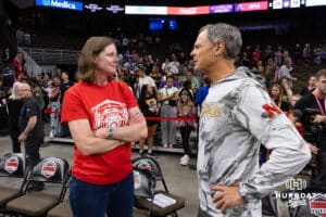 Former Nebraska head coach John Cook talks to former Husker and 1995 team member Allison Weston after the match between Supernovas and the Thrill Friday, March 28, 2025 in Omaha, Nebraska. Photo by John S. Peterson.