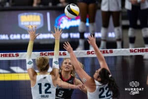 Omaha Supernovas Brooke Nuneviller (5) tips the ball over Vegas Thrill Berkeley Oblad (12) and Carly Graham (22) during a professional volleyball match Friday, March 28, 2025 in Omaha, Nebraska. Photo by John S. Peterson.