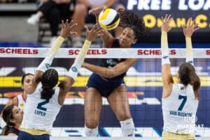 Omaha Supernovas Kaitlyn Hord (23) spikes the ball against Vegas Thrill Charitie Luper (2) and Layne Van Buskirk (7) in the second set during a professional volleyball match Friday, March 28, 2025 in Omaha, Nebraska. Photo by John S. Peterson.