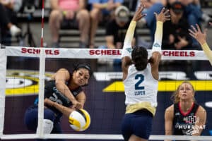Omaha Supernovas Kayla Caffey (28) spikes it passed Vegas Thrill Charitie Luper (2) in the second set during a professional volleyball match Friday, March 28, 2025 in Omaha, Nebraska. Photo by John S. Peterson.
