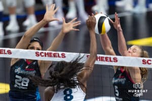 Omaha Supernovas Brooke Nuneviller (5) blocks a shot with Kayla Caffey (28) against Vegas Thrill Camryn Hannah (8) during a professional volleyball match Friday, March 28, 2025 in Omaha, Nebraska. Photo by John S. Peterson.