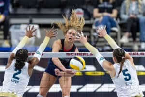 Omaha Supernovas Brooke Nuneviller (5) spikes the ball between Vegas Thrill Charitie Luper (2) and Morgan Stout (5) in the second set during a professional volleyball match Friday, March 28, 2025 in Omaha, Nebraska. Photo by John S. Peterson.