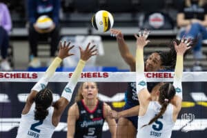 Omaha Supernovas Kaitlyn Hord (23) spikes the ball against Vegas Thrill Charitie Luper (2) and Morgan Stout (5) in the second set during a professional volleyball match Friday, March 28, 2025 in Omaha, Nebraska. Photo by John S. Peterson.
