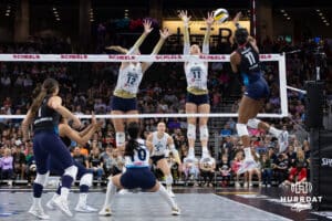 Omaha Supernovas Kelsie Payne (11) spikes the ball against Vegas Thrill Berkeley Oblad (12) and Hannah Maddux (11) during a professional volleyball match Friday, March 28, 2025 in Omaha, Nebraska. Photo by John S. Peterson.