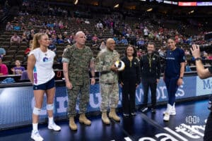 r Force General Cotton delivers the game ball to the officials for the match between the Supernovas and the Thrill during a professional volleyball match Friday, March 28, 2025 in Omaha, Nebraska. Photo by John S. Peterson.