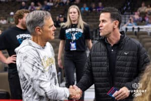 John Cook shaking hands with Eric Sullivan, head coach for USA Volleyball women's team, before the Supernovas take on the Thrill a professional volleyball match Friday, March 28, 2025 in Omaha, Nebraska. Photo by John S. Peterson.