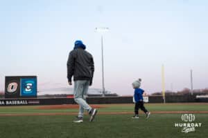 Creighton Bluejays Head Coach Ed Servais walks with a family memeber after a college baseball game against Omaha on March 25th, 2025 in Omaha, Nebraska. Photo by Brandon Tiedemann.