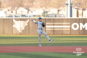 Creighton Bluejays Kyle Hess throws to first during a college baseball game against Omaha on March 25th, 2025 in Omaha, Nebraska. Photo by Brandon Tiedemann.