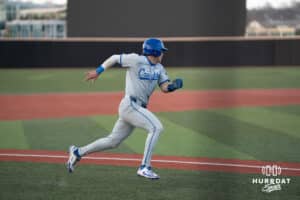 Creighton Bluejays Kyle Hess runs home during a college baseball game against Omaha on March 25th, 2025 in Omaha, Nebraska. Photo by Brandon Tiedemann.