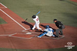 Omaha Mavericks Mason Gaines swings and misses during a college baseball game against Creighton on March 25th, 2025 in Omaha, Nebraska. Photo by Brandon Tiedemann.