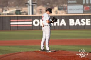 Omaha Mavericks Carter Mick looks at his pitch sheet during a college baseball game against Creighton on March 25th, 2025 in Omaha, Nebraska. Photo by Brandon Tiedemann.