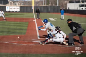 Creighton Bluejays Tate Gillen bunts during a college baseball game against Omaha on March 25th, 2025 in Omaha, Nebraska. Photo by Brandon Tiedemann.