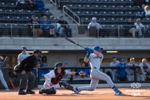 Creighton Bluejays Will MacLean hits the ball during a college baseball game against Omaha on March 25th, 2025 in Omaha, Nebraska. Photo by Brandon Tiedemann.