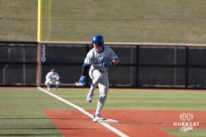 Creighton Bluejays Nolan Sailors celebrates a triple during a college baseball game against Omaha on March 25th, 2025 in Omaha, Nebraska. Photo by Brandon Tiedemann.