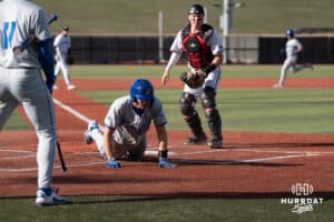 Creighton Bluejays Dakota Duffalo slides into home during a college baseball game against Omaha on March 25th, 2025 in Omaha, Nebraska. Photo by Brandon Tiedemann.