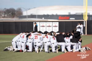 Omaha Mavericks huddle before a college baseball game against Creighton on March 25th, 2025 in Omaha, Nebraska. Photo by Brandon Tiedemann.