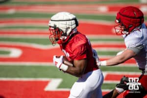 Running back Emmett Johnson runs the ball into the endzone during Nebraska football practice Thursday, March 27, 2025 in Lincoln, Nebraska. Photo by John S. Peterson.