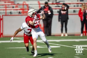 Wide receiver Roman Mangini (26) makes a catch against Malcolm Hartzog Jr. (7) during Nebraska football practice Thursday, March 27, 2025 in Lincoln, Nebraska. Photo by John S. Peterson.