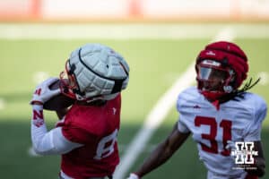 Wide receiver Isaiah Mozee (84) makes a catch against Mario Buford (31) during Nebraska football practice Thursday, March 27, 2025 in Lincoln, Nebraska. Photo by John S. Peterson.
