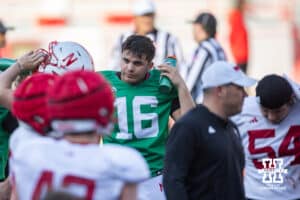 Quarterback Marcos Davila (16) getting a drink during Nebraska football practice Thursday, March 27, 2025 in Lincoln, Nebraska. Photo by John S. Peterson.