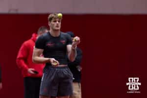Thomas Fidone II juggling tennis balls waiting during Nebraska Pro Day Tuesday, March 25, 2025 in Lincoln, Nebraska. Photo by John S. Peterson.