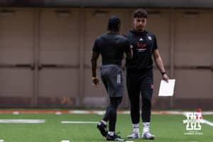 Dylan Raiola shakes hand Rhamir Johnson with during Nebraska Pro Day Tuesday, March 25, 2025 in Lincoln, Nebraska. Photo by John S. Peterson.