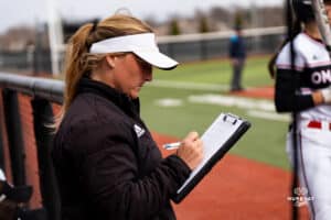 Omaha Maverick assistant coach Jen Daro takes notes during a softball game at Connie Clausen Field on March 22nd, 2025 in Omaha Nebraska. Photo by Collin Stilen.