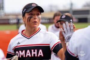 Omaha Maverick gives high five during a softball game at Connie Clausen Field on March 22nd, 2025 in Omaha Nebraska. Photo by Collin Stilen.