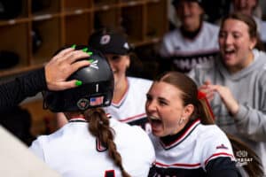 Omaha Maverick Maggie O'Brien high fives with teammates during a softball game at Connie Clausen Field on March 22nd, 2025 in Omaha Nebraska. Photo by Collin Stilen.