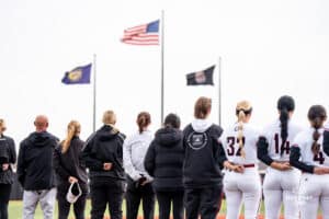 Omaha Maverick line up for the national anthem during a softball game at Connie Clausen Field on March 22nd, 2025 in Omaha Nebraska. Photo by Collin Stilen.