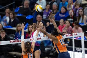 Omaha Supernovas Reagan Cooper (8) spikes the ball against Indy Ignite Caroline Crawford (12) and Azhani Tealer (19) during a professional volleyball match Saturday, March 22, 2025 in Lincoln, Nebraska. Photo by John S. Peterson.