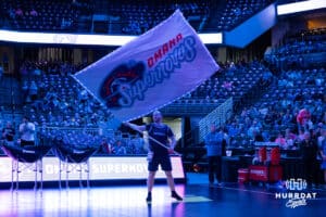 Omaha Supernovas Spirit Squad member waves the Supernovas flag before taking on the Indy Ignite during a professional volleyball match Saturday, March 22, 2025 in Lincoln, Nebraska. Photo by John S. Peterson.