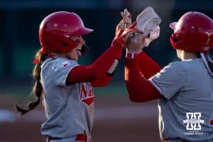 Nebraska Cornhusker Ava Kuszak (7) and Olivia DiNardo (1) celebrates the win over the Minnesota Golden Gophers during a college softball game Friday, March 21, 2025 in Lincoln, Nebraska. Photo by John S. Peterson.