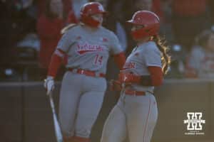 Nebraska Cornhusker Ava Kuszak (7) scores in the sixth inning against the Minnesota Golden Gophers during a college softball game Friday, March 21, 2025 in Lincoln, Nebraska. Photo by John S. Peterson.