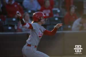 Nebraska Cornhusker Hannah Camenzind (9) hits a double in the sixith inning against the Minnesota Golden Gophers during a college softball game Friday, March 21, 2025 in Lincoln, Nebraska. Photo by John S. Peterson.