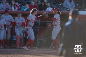 Nebraska Cornhusker Jordyn Bahl (98) and Samantha Bland celebrates the last out of the fifth inning against the Minnesota Golden Gophers during a college softball game Friday, March 21, 2025 in Lincoln, Nebraska. Photo by John S. Peterson.