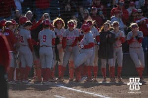 Nebraska Cornhusker Kacie Hoffmann (14) scores after hitting a home run against the Minnesota Golden Gophers in the third inning during a college softball game Friday, March 21, 2025 in Lincoln, Nebraska. Photo by John S. Peterson.