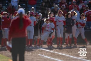 Nebraska Cornhusker Katelyn Caneda (66) scores on the Kacie Hoffmann home run in against the Minnesota Golden Gophers in the third innning during a college softball game Friday, March 21, 2025 in Lincoln, Nebraska. Photo by John S. Peterson.