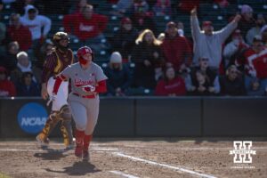 Nebraska Cornhusker Kacie Hoffmann (14) hits a three run home run against the Minnesota Golden Gophers in the third inning during a college softball game Friday, March 21, 2025 in Lincoln, Nebraska. Photo by John S. Peterson.