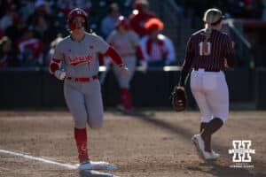 Nebraska Cornhusker Olivia DiNardo (1) singles in the third against the Minnesota Golden Gophers during a college softball game Friday, March 21, 2025 in Lincoln, Nebraska. Photo by John S. Peterson.