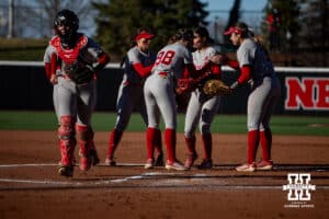 Nebraska Cornhuskers huddle brakes up to take on the Minnesota Golden Gophers in the second inning during a college softball game Friday, March 21, 2025 in Lincoln, Nebraska. Photo by John S. Peterson.