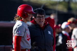 Nebraska Cornhusker Jordyn Bahl (98) talks to coach Diane Miller before her at bat against the Minnesota Golden Gophers during a college softball game Friday, March 21, 2025 in Lincoln, Nebraska. Photo by John S. Peterson.