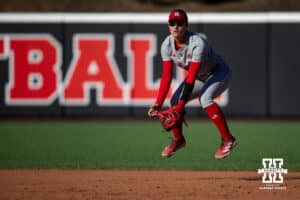 Nebraska Cornhusker Lauren Camenzind (2) jumps preparing for a hit against the Minnesota Golden Gophers during a college softball game Friday, March 21, 2025 in Lincoln, Nebraska. Photo by John S. Peterson.