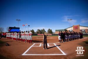 The National Anthem is performed before the Nebraska Cornhuskers take on the Minnesota Golden Gophers during a college softball game Friday, March 21, 2025 in Lincoln, Nebraska. Photo by John S. Peterson.
