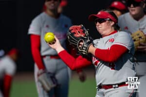 Nebraska Cornhusker utility Malia Thoms (4) throws the ball warming up for Minnesota during a college softball game Friday, March 21, 2025 in Lincoln, Nebraska. Photo by John S. Peterson.
